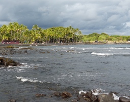 Black sand beach and dramatic clouds